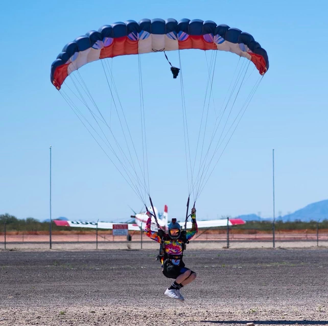 Founder Kaden Reese swooping under canopy at the dropzone